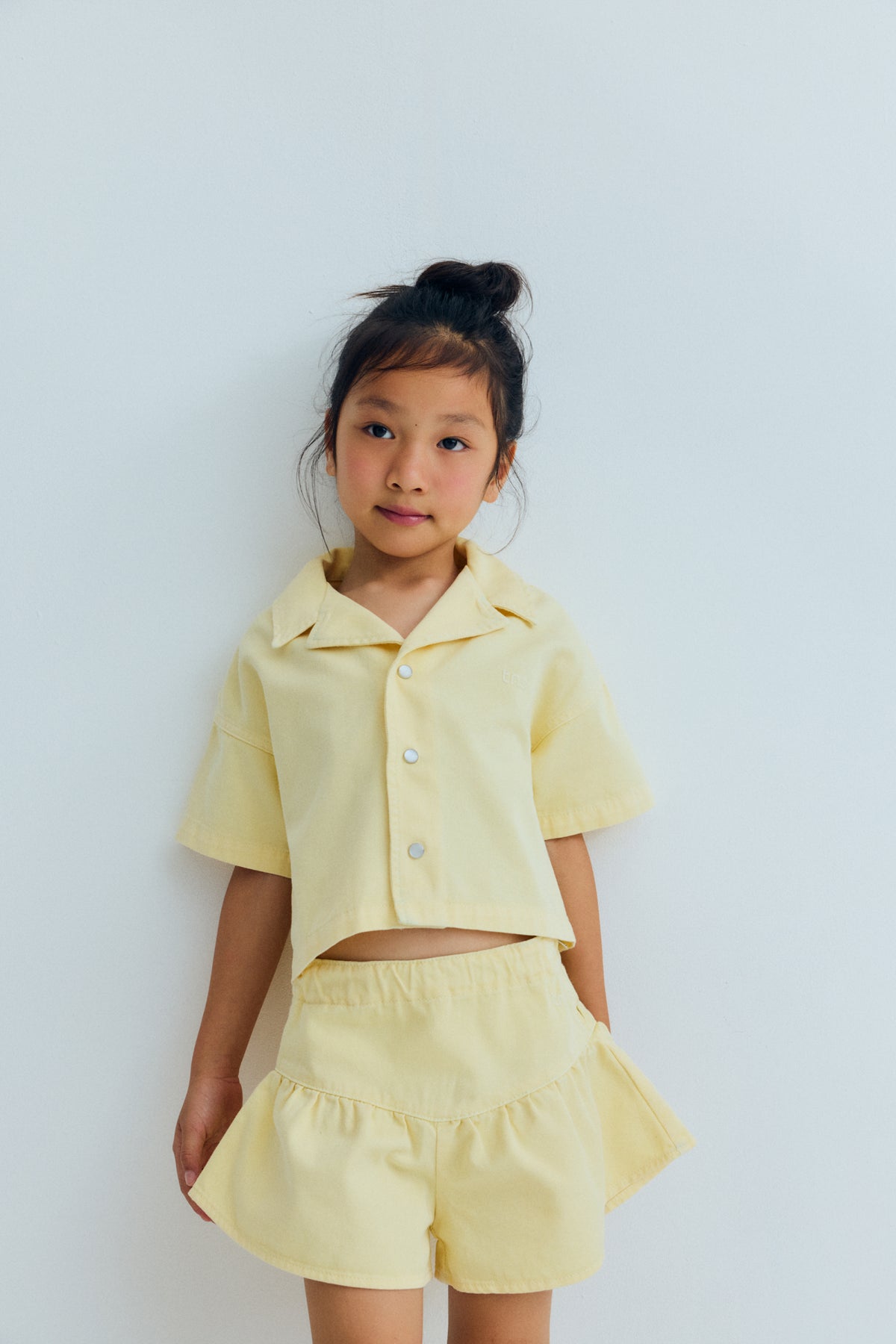Bellis short Soft Lemon, The New Society